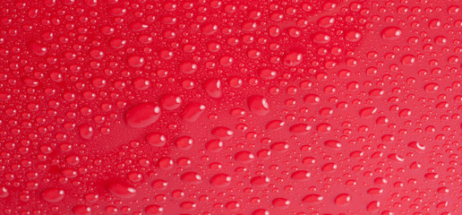 Abstract water drops on a red background
