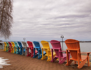 Adirondack chairs on the shore of The Saint Lawrence River