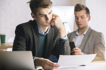 Handsome man drawing architectural sketch