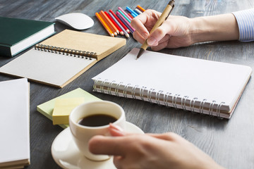 Lady writing in notepad
