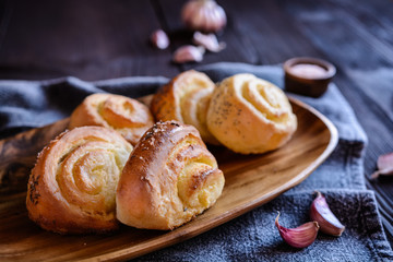 Baked savory bread rolls stuffed with garlic
