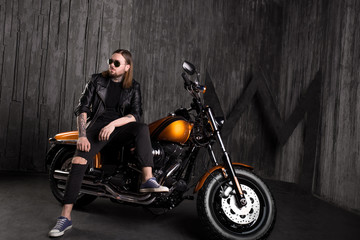biker caucasian man sitting on motorbike
