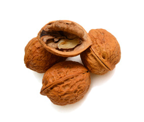 Cracked walnuts isolated on white background