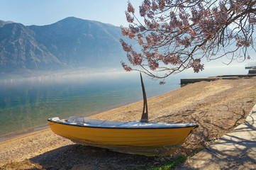 One boat on the shore of the Bay of Kotor on a spring morning. Montenegro
