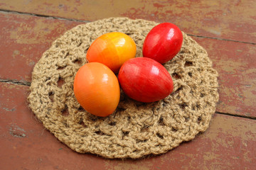 Colorful decorative easter eggs on a wooden surface.