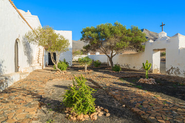 Courtyard and gardens of typical white Canary style church in Tefia village, Fuerteventura, Canary Islands, Spain