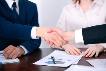 Business people shaking hands finishing up a meeting