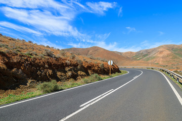 Fototapeta na wymiar Scenic mountain road with volcano view near Tuineje village, Fuerteventura, Canary Islands, Spain
