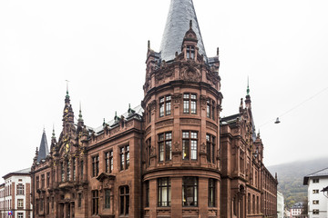 Fototapeta premium Heidelberg University Library viewed from crossing of Ploeck and Grabengasse on autumn cloudy day in Heidelberg, Germany