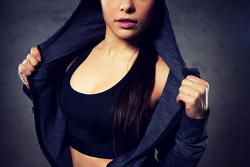 close up of woman posing and showing sportswear