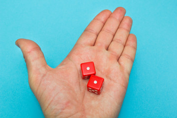 Red dices in the hand, failure.