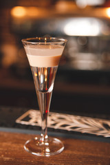 Cocktail on bar desk, close-up.