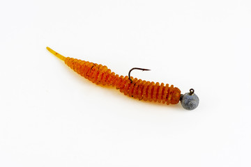 Exhibition of pirated copies of fishing metal spoon baits. Bait for fishing in the shape of a spoon with a hook on a white background