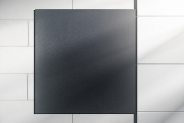 Tile wall with black poster