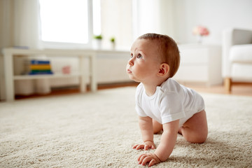 little baby in diaper crawling on floor at home - obrazy, fototapety, plakaty