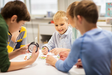 Fototapeta premium happy children building robots at robotics school