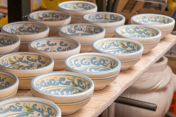 Closeup view of some decorated ceramic bowls in a workshop of Caltagirone, Sicily