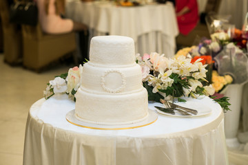 wedding cake, festive multi-storey cake, a cake in white tone, European wedding American wedding