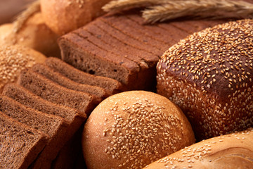 Assortement of Freshly baked traditional bread with ears of wheat