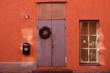 Door and window on the red wall, Finnish Style, Helsinki, Finland