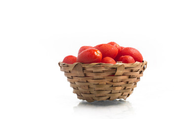 Cherry Tomatoes into a basket