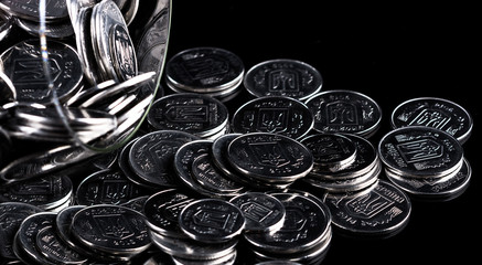 silver coins on black background