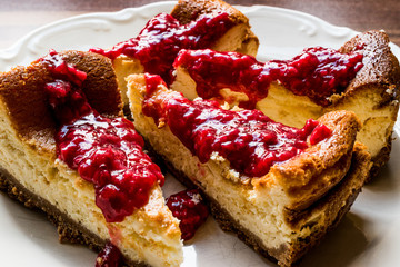 Homemade Raspberry Cheesecake in white plate