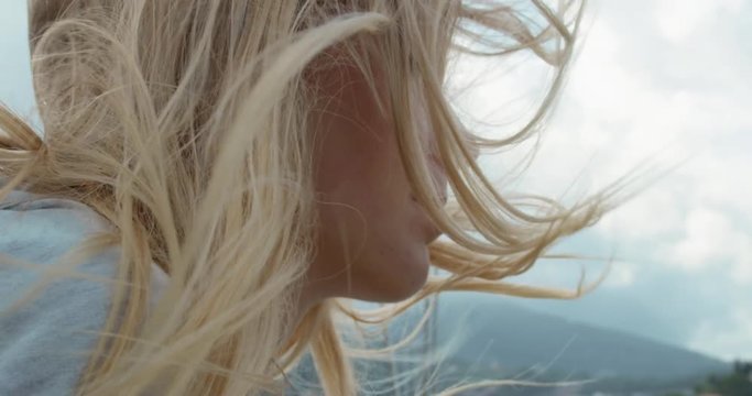 Beautiful girl hair closeup on sailboat in ocean on luxury lifestyle happy adventure travel vacation slow motion