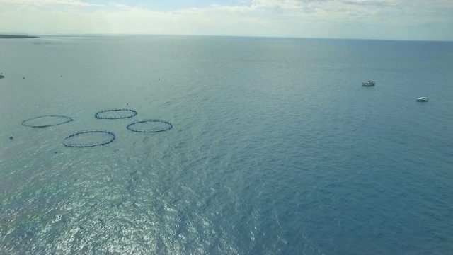 Approaching circular cages for fish farming in the Atlantic Ocean Canary Islands