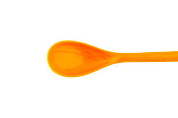 Orange plastic spoon