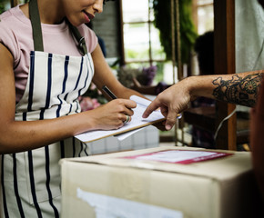Man Deliver Mail Box to Woman in front of Stop