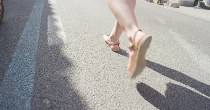 Close up feet walking in sandals on Italian street exploring European town Tourist women travelling in beautiful Italy enjoying summer vacation travel adventure