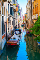 Obraz na płótnie Canvas Reflections on Canal in Venice Italy