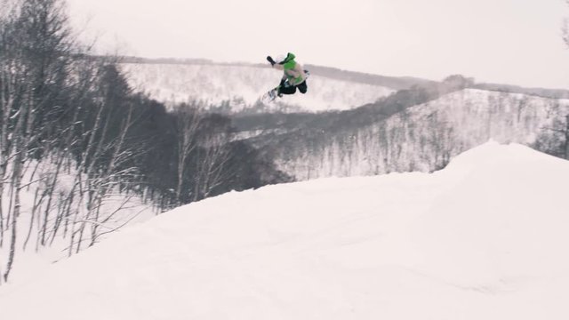 Snowboarding Freestyle Big Method Air Off Jump
