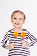 Happy girl with lollipop.