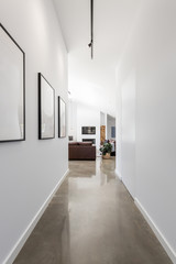 Cool contemporary new home entrance hall to living room