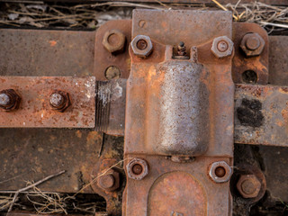 Rusted bolts on train tracks