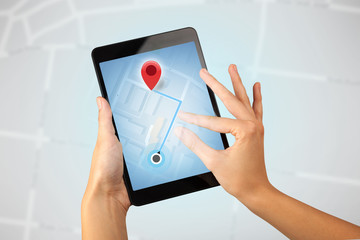 Female hand holding tablet