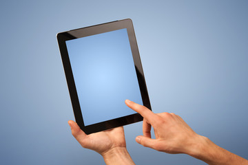 Female hand holding tablet