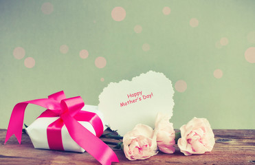 Gift box, three pink carnations, paper note