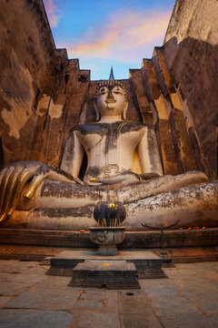 Seated Buddha image at  Wat Si Chum temple in Sukhothai Historical Park, a UNESCO world heritage site in Thailand