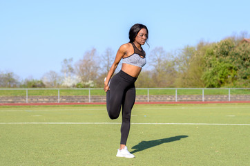 Fit muscular young African woman