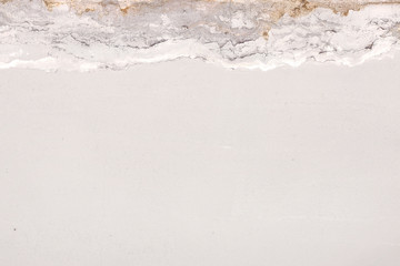 traces of streaks of water on the wall. Crumbling plaster on the ceiling. Moldy crumbling wall texture. 