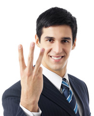 Businessman showing three fingers, isolated