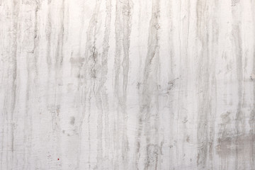 stucco concrete wall with stains from water