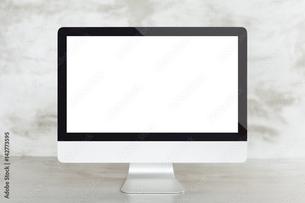 Aufkleber desktop computer on work desk showing blank screen