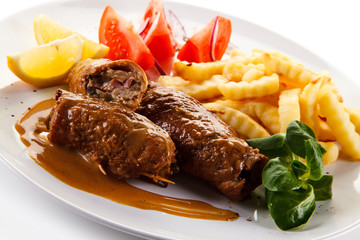 Wrapped pork chop with french fries