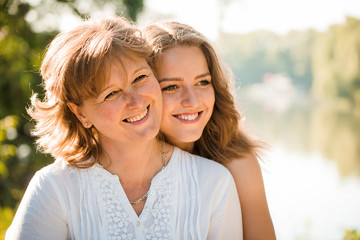 Fototapeta premium Mother and daughter outdoor portrait