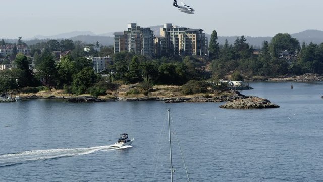 Panning view of boats and sea plane