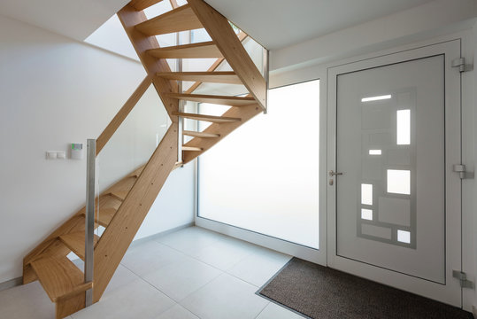 Interior of hallway with wooden stairway